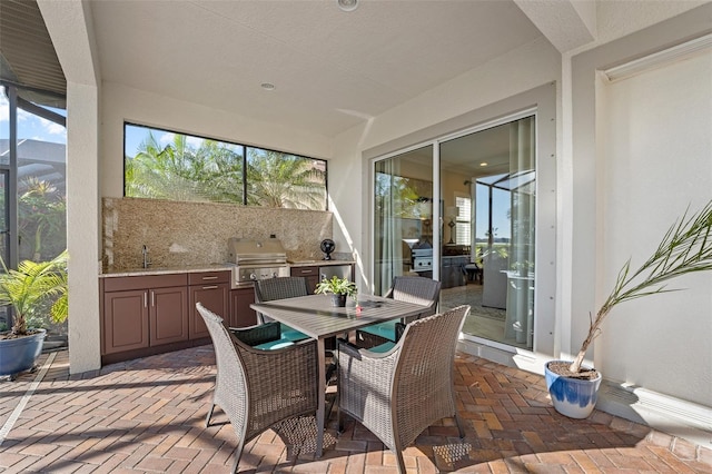 sunroom with sink and a wealth of natural light