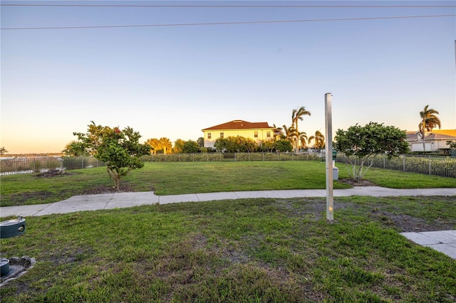 view of yard at dusk