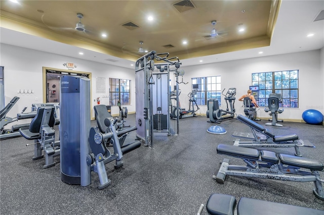 workout area with a raised ceiling