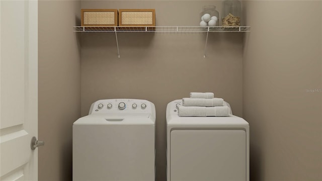 washroom featuring washer and dryer