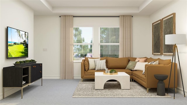 living room with light carpet and a tray ceiling