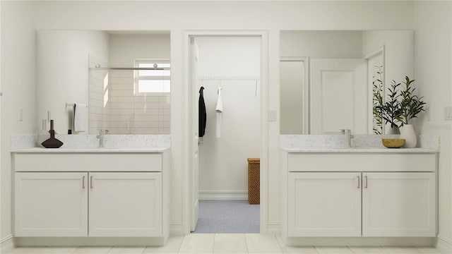 bathroom featuring walk in shower and vanity