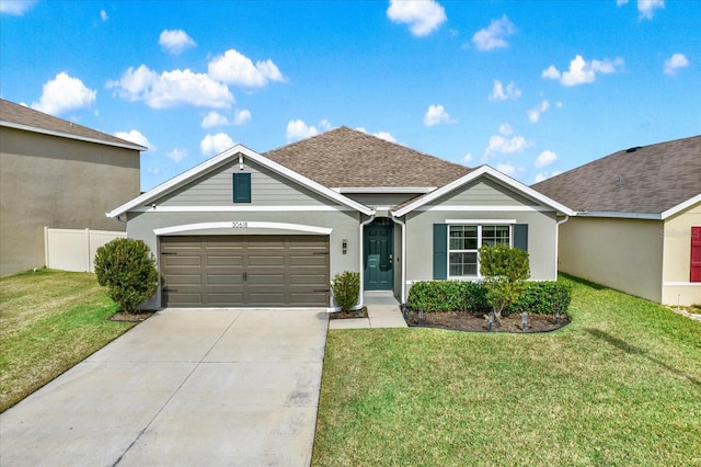 ranch-style house with a garage and a front yard