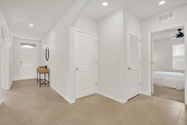 hall with light tile patterned flooring