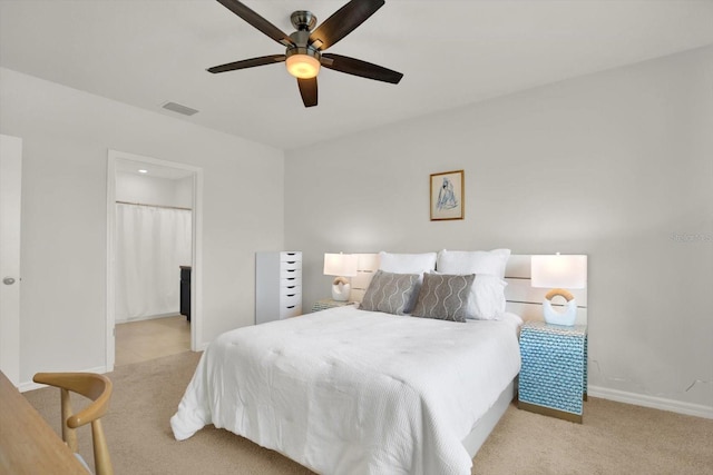 bedroom with light carpet and ceiling fan