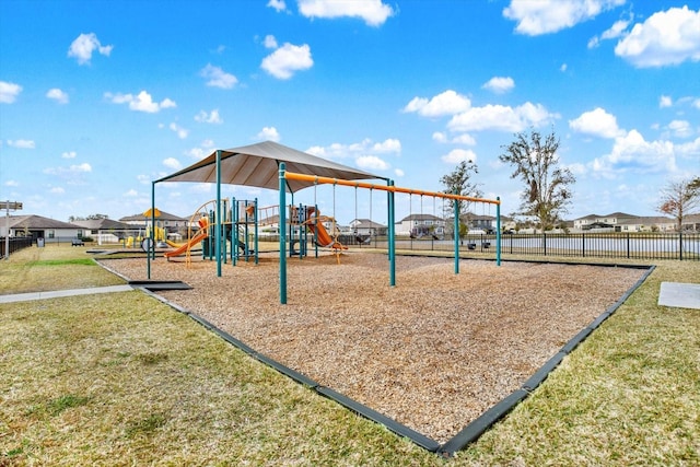 view of playground with a lawn