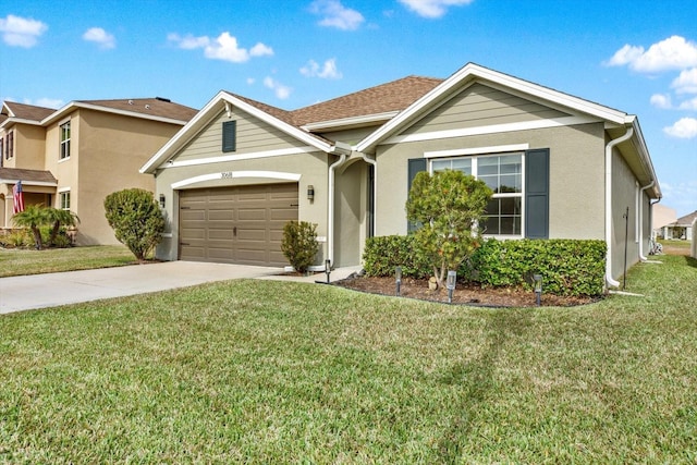 view of front of home featuring a garage and a front yard