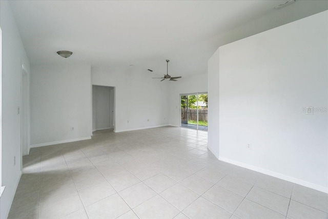 spare room with light tile patterned floors and ceiling fan