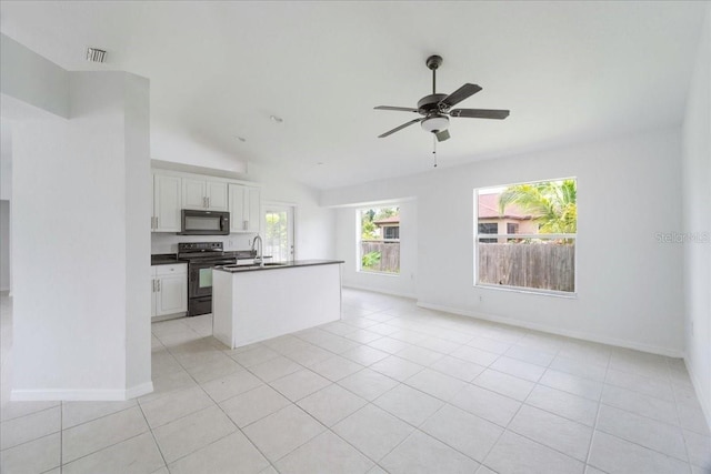 kitchen featuring lofted ceiling, ceiling fan, white cabinetry, black appliances, and light tile patterned flooring