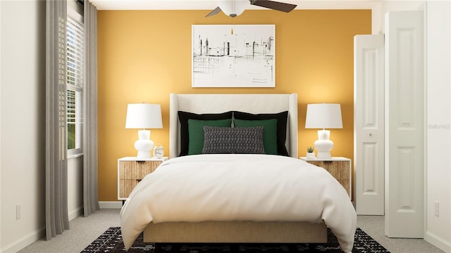 bedroom featuring ceiling fan and carpet