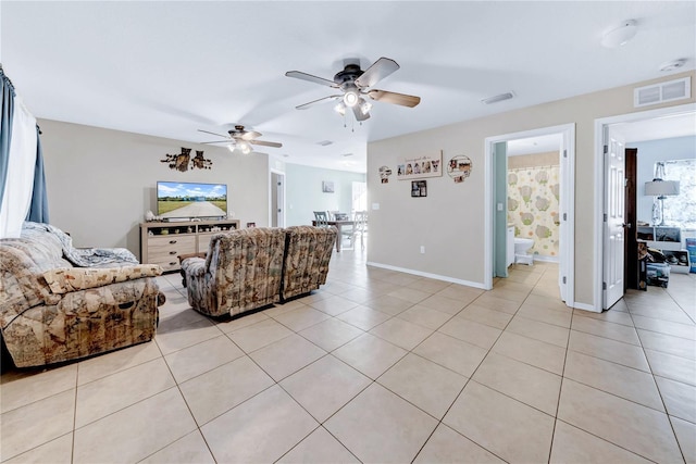 tiled living room featuring ceiling fan