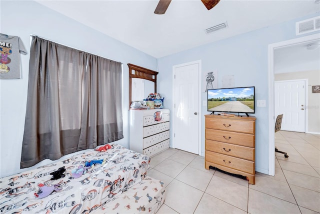 bedroom featuring light tile patterned floors and ceiling fan