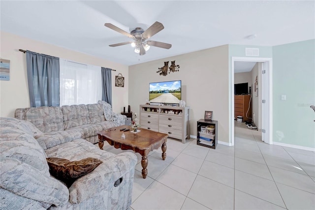 living room with ceiling fan and light tile patterned floors