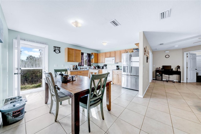 dining area with light tile patterned floors