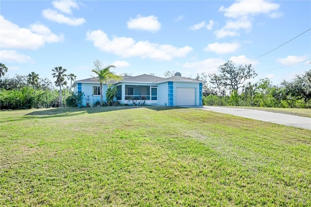 single story home featuring a garage and a front lawn