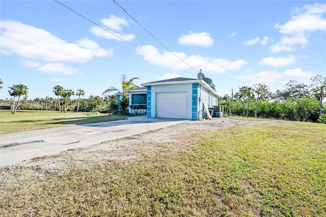 view of home's exterior with a yard and a garage