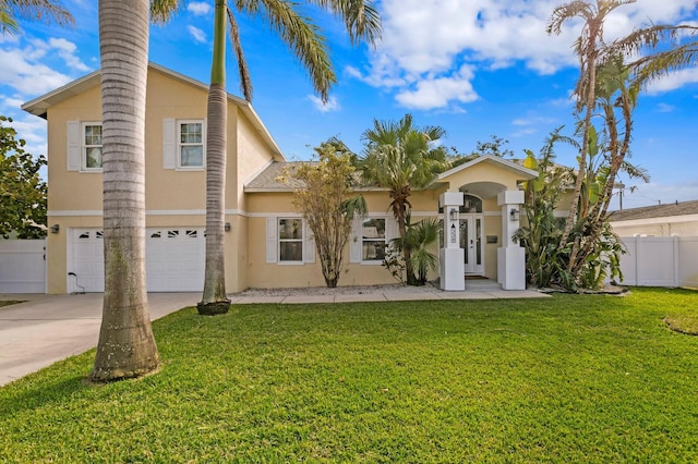 view of front of home featuring a garage and a front lawn