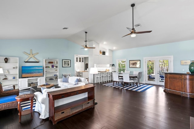 living room featuring vaulted ceiling, dark hardwood / wood-style floors, ceiling fan, and french doors