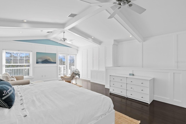 bedroom with dark wood-type flooring, ceiling fan, multiple windows, and vaulted ceiling with beams