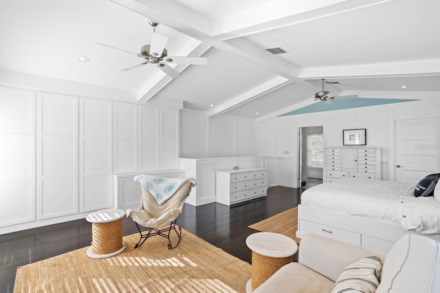 bedroom with ceiling fan, dark hardwood / wood-style floors, and vaulted ceiling with beams