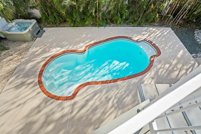 view of pool featuring a patio area