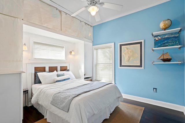 bedroom featuring ornamental molding, ceiling fan, and dark hardwood / wood-style flooring