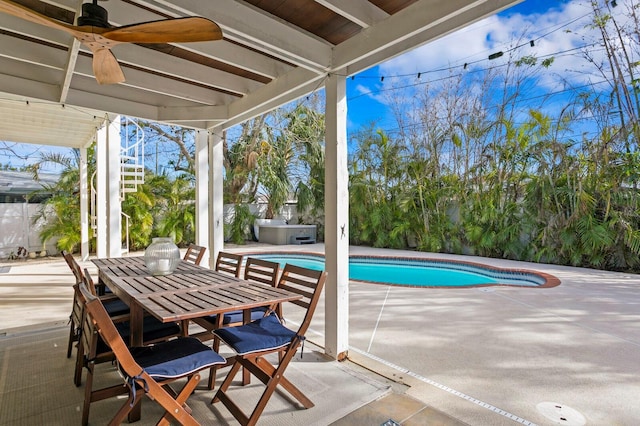 exterior space with a jacuzzi, a patio, and ceiling fan