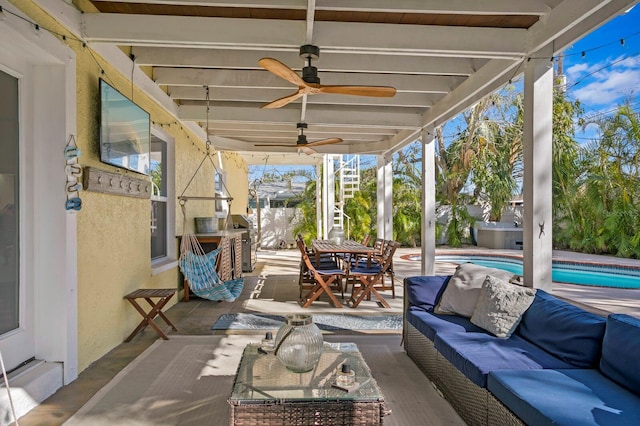 view of patio featuring outdoor lounge area and a pool with hot tub