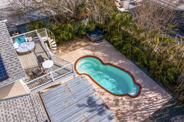 view of swimming pool featuring a patio area