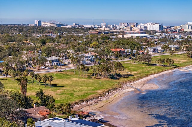 birds eye view of property featuring a beach view and a water view