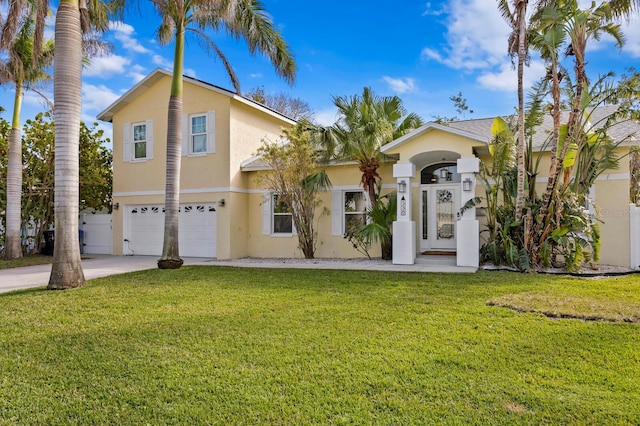 view of front of house with a garage and a front lawn