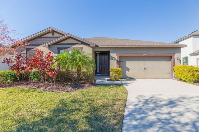 view of front facade featuring an attached garage, a front lawn, concrete driveway, and stucco siding