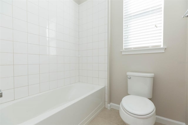 bathroom with  shower combination, tile patterned flooring, baseboards, and toilet