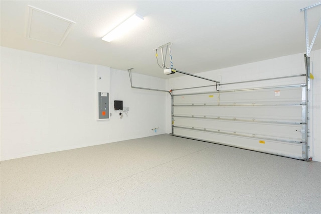 garage with electric panel and a garage door opener