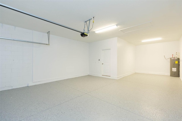 garage featuring water heater and a garage door opener