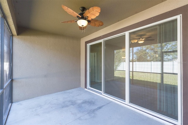 exterior space with a ceiling fan and a patio