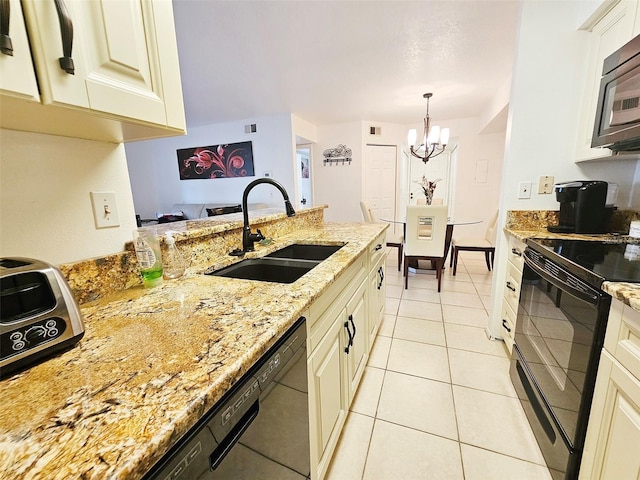 kitchen with sink, light tile patterned floors, pendant lighting, light stone countertops, and black appliances