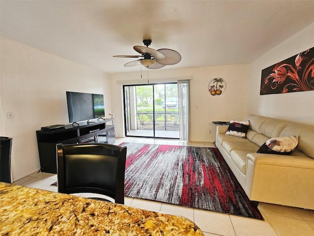 tiled living room with ceiling fan