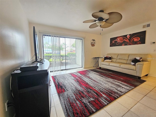 tiled living room featuring ceiling fan