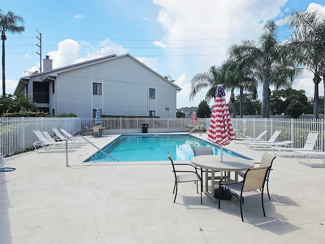 view of swimming pool with a patio