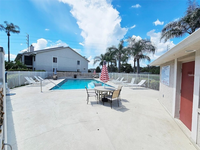 view of swimming pool with a patio