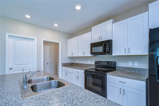 kitchen featuring white cabinetry, sink, and black appliances