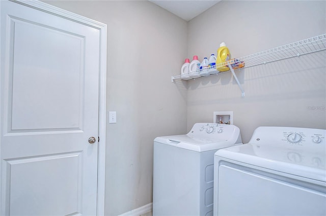 washroom featuring washing machine and clothes dryer