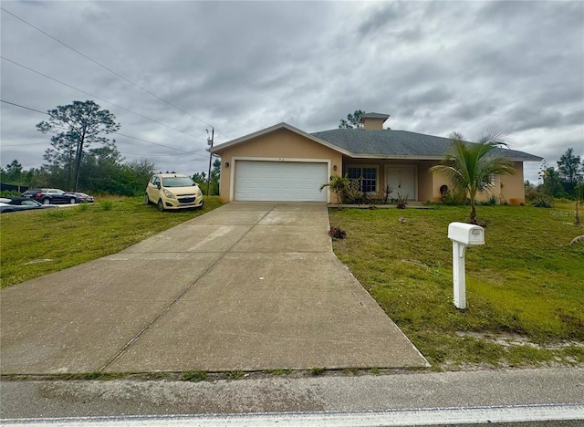 view of front of property featuring a garage and a front yard