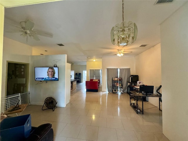 living room featuring light tile patterned flooring and ceiling fan with notable chandelier