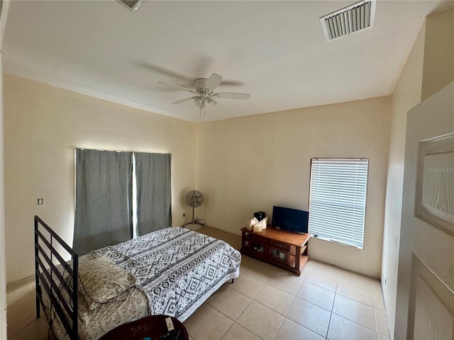 bedroom with light tile patterned floors and ceiling fan