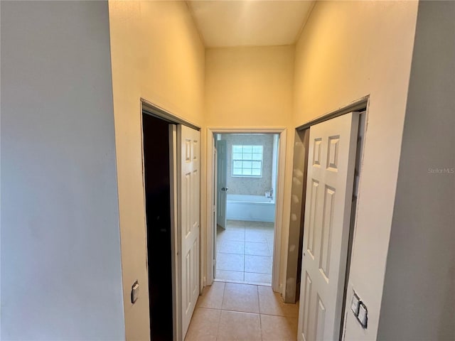 corridor featuring light tile patterned flooring