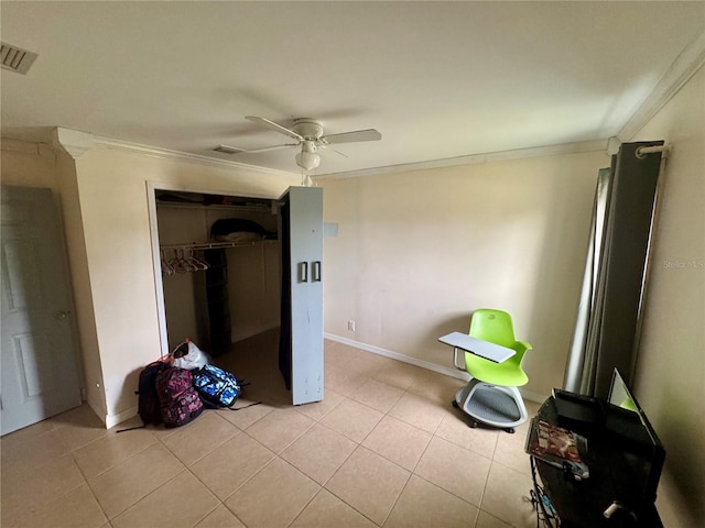 unfurnished bedroom with crown molding, ceiling fan, a closet, and light tile patterned floors