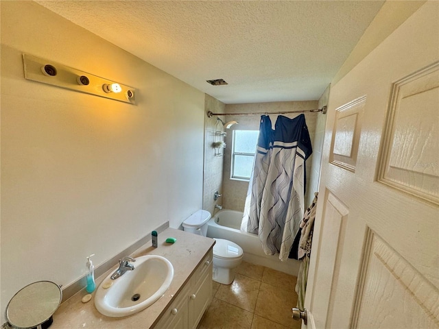 full bathroom with shower / tub combo with curtain, vanity, a textured ceiling, tile patterned floors, and toilet