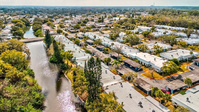 bird's eye view with a residential view and a water view